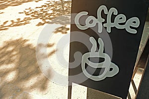Sign at coffee shop with hot coffee icon