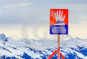 Sign `Danger of avalanches` on top of the mountain Hohe Salve. Ski resort Soll, Tyrol