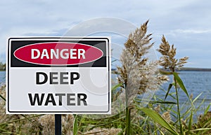 Sign danger deep water on the shore of the reservoir