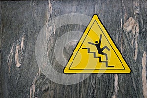 Sign of danger of falling stairs slip warning caution on marble photo