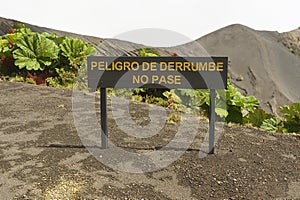 Sign Danger of land slide, do not pass at the Irazu volcano crater, Costa Rica.