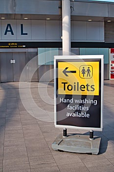 A sign at the deserted South Terminal of Gatwick Airport points the way to toilets and hand washing facilities