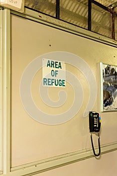 Sign designating an area of refuge