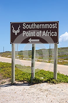 A sign directing to of Cape Agulhas, the southernmost point of africa