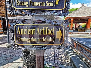 A sign directing tourists to an ancient artefact on the Bai island in Indonesia