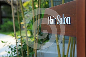 Sign of direction to hair salon in a hotel, resort and spa