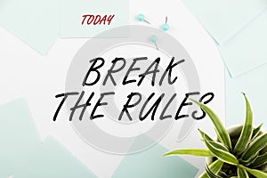 Sign displaying Break The RulesTo do something against formal rules and restrictions. Word Written on To do something photo