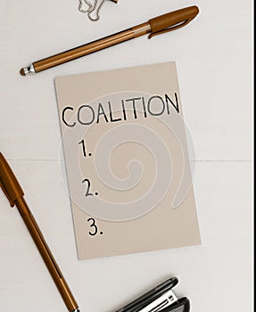 Sign displaying Coalition. Concept meaning a temporary alliance of distinct parties, persons, or states for joint action
