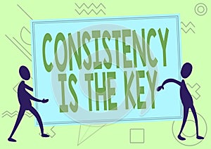 Sign displaying Consistency Is The Key. Word Written on by Breaking Bad Habits and Forming Good Ones Two Colleagues