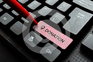 Sign displaying Donation. Conceptual photo something that is given to a charity, especially a sum of money Typing Online