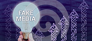 Sign displaying Fake Media. Business overview An formation held by brodcasters which we cannot rely on photo