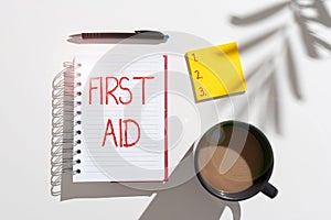 Sign displaying First Aid. Internet Concept Practise of healing small cuts that no need for medical training Notebook