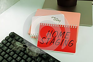 Sign displaying Home Staging. Concept meaning preparation of a private residence for sale in the real estate marketplace