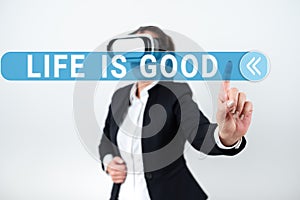 Sign displaying Life Is Good. Word Written on Obtain everything you want and more have health great job Woman Wearing Vr