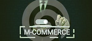 Sign displaying M Commerce. Business approach commercial transactions conducted electronically by mobile phone Lady in