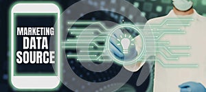 Sign displaying Marketing Data Source. Word Written on connection set up to a database from a server