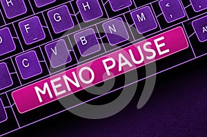 Sign displaying Meno Pause. Word for the process through which a woman ceases to be fertile or menstruate