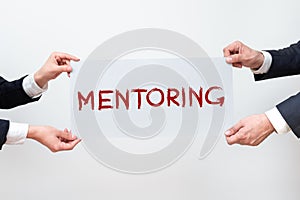 Sign displaying Mentoring. Internet Concept the achievement of desired visions and planned goals