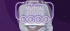 Sign displaying Mutual Funds. Conceptual photo An investment program funded by shareholders Individual Stocks