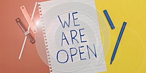 Sign displaying We Are Open. Business idea no enclosing or confining barrier, accessible on all sides