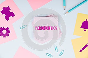Sign displaying Periodontics. Word Written on a branch of dentistry deals with diseases of teeth, gums, cementum photo