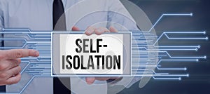 Sign displaying Self Isolation. Internet Concept promoting infection control by avoiding contact with the public photo