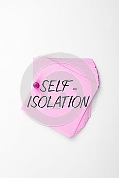 Sign displaying Self Isolation. Word Written on promoting infection control by avoiding contact with the public photo