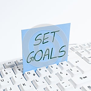 Sign displaying Set Goals. Conceptual photo Defining or achieving something in the future based on plan