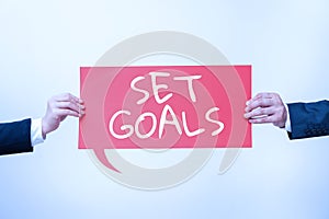 Sign displaying Set Goals. Word for Defining or achieving something in the future based on plan