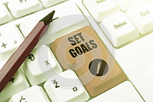 Sign displaying Set Goals. Word for Defining or achieving something in the future based on plan Frame Decorated With