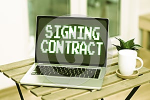 Sign displaying Signing Contract. Business concept the parties signing the document agree to the terms Voice And Video
