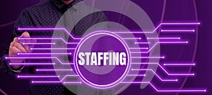 Sign displaying Staffing. Concept meaning The percentage of workers that replaced by new employees