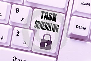 Sign displaying Task Scheduling. Business overview The assignment of start and end times to a set of tasks Voice And