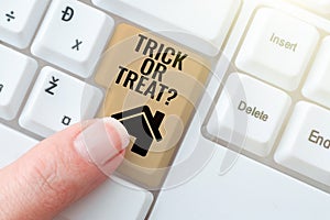 Sign displaying Trick Or Treat. Conceptual photo Halloween tradition consisting in asking for sweets Four Hands Drawing