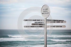 Sign with distances, Dunedin, New Zealand photo