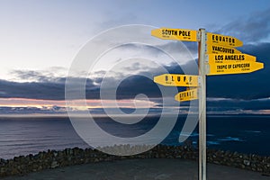 Sign with distances in km and nm from Cape Reinga photo