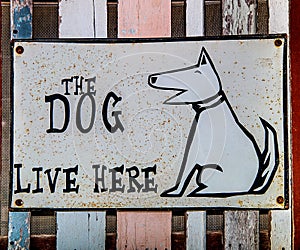 Sign dog live here