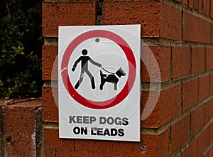 Sign for dog walkers in a public park Wallasey Wirral July 2019