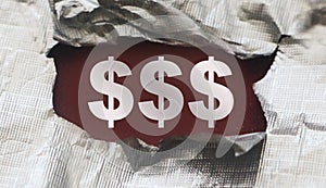 Sign of Dollar Symbol under torn foil paper. Business Profit concept, revealing hidden possibilities career or business