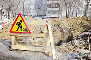 Sign Earthworks at dug trench with fence tape.