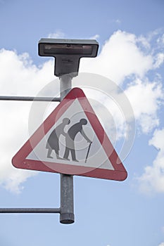 Sign elderly people crossing on the street.