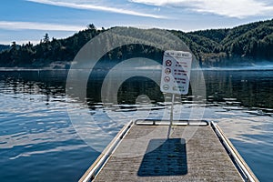 Sign at the end of a dock at Tenmile Lake in Lakeside, Oregon, USA