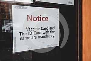 Sign at the entrance of local restaurant BC Vaccine Card and ID Card with the name are mandatory