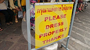 Sign at the entrance of a temple to dress properly