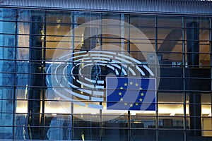 Sign and EU flag symbol on the European Commission building exterior