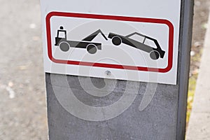 Sign evacuation of car to impound No parking any time Punishment symbol photo