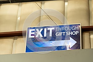 Sign - Exit through the gift shop, consumerism concept