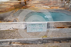 Sign for Firehole Spring, a hot spring thermal feature along Firehole Lake Drive in Yellowstone National Park