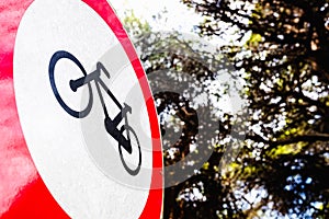 Sign forbidden to ride a bicycle, placed in a forest