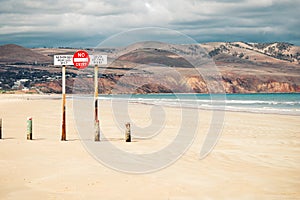 A sign forbidding entry to the beach by unauthorised cars